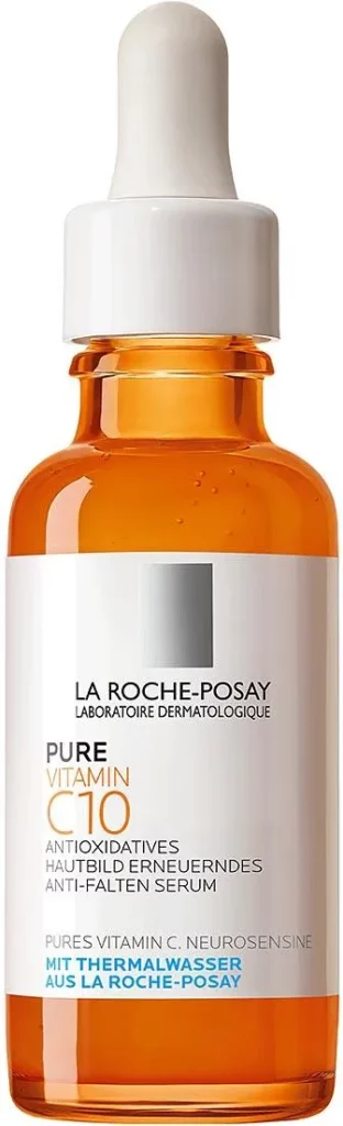 Butelka serum La Roche-Posay z pipetą zawiera pomarańczowy płyn, ustawiona na białym tle.