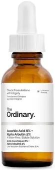 Brązowa butelka serum z białą pipetą stojąca na jasnym tle, etykieta "The Ordinary".