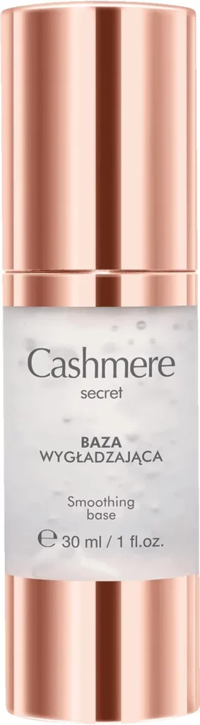Butelka bazy wygładzającej stoi pionowo na białym tle, oznaczona "Cashmere", metaliczny różowo-złoty korek.